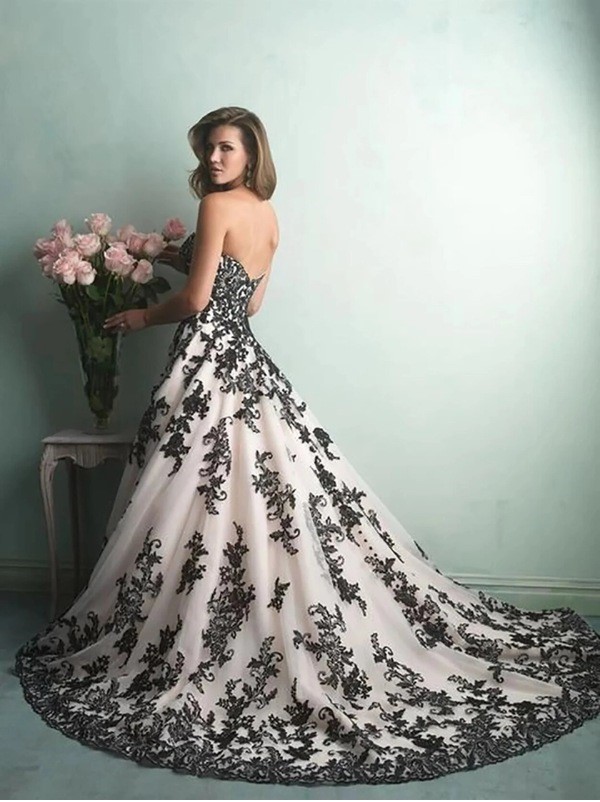 Elegant gothic mermaid gown in black and white ideal for a springtime wedding.