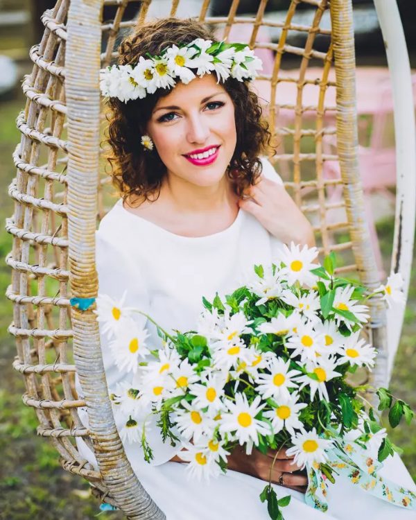 Hairstyles for short hair that incorporate flower crown headpieces are a beautiful idea for a summer wedding.