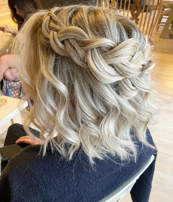 Short hair with waves plaits and a half updo is perfect for a wedding.