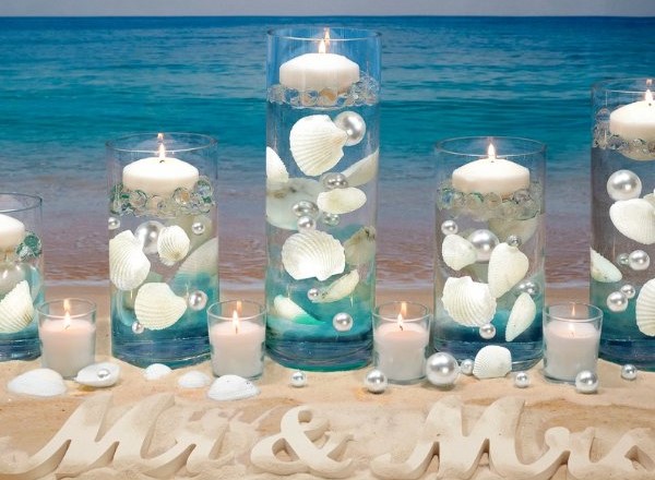 This magnificent floating sea shell wedding candle centerpiece will enchant your guests with the flickering flames and natural beauty of the sea shells.