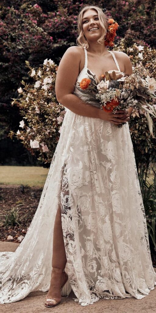 This plus size beach wedding dress features modern art rose embroidery making it just One dress every bride has been waiting for.
