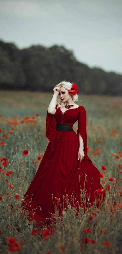 This red and black fantasy bridal gown with a dramatic belt accentuates your curves suitable for a gothic wedding.