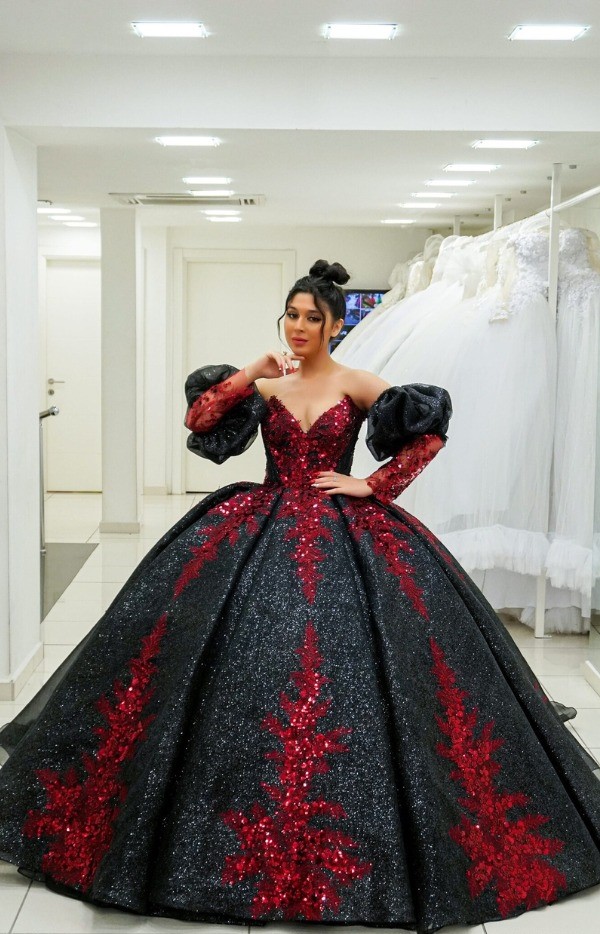 This red and black wedding ballgown is a spectacular masterpiece that blends traditional style with modern appeal