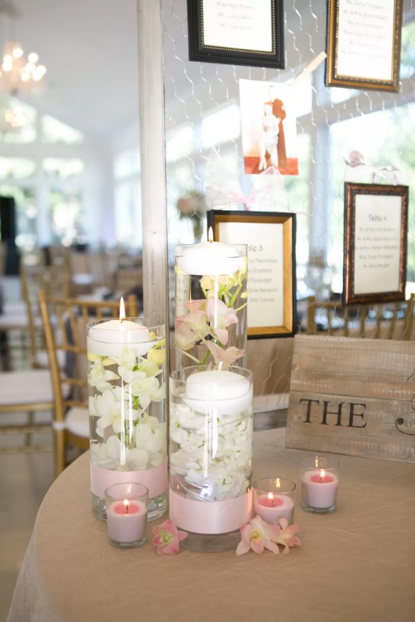 Wedding receptions can have a super romantic ambiance with floating candle centerpieces and flower arrangements on each table.