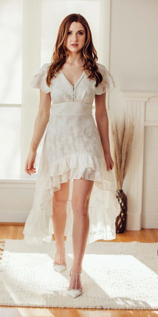 You'll be able to move freely and gracefully in this lovely short beach wedding dress with ruffle butterfly sleeves.