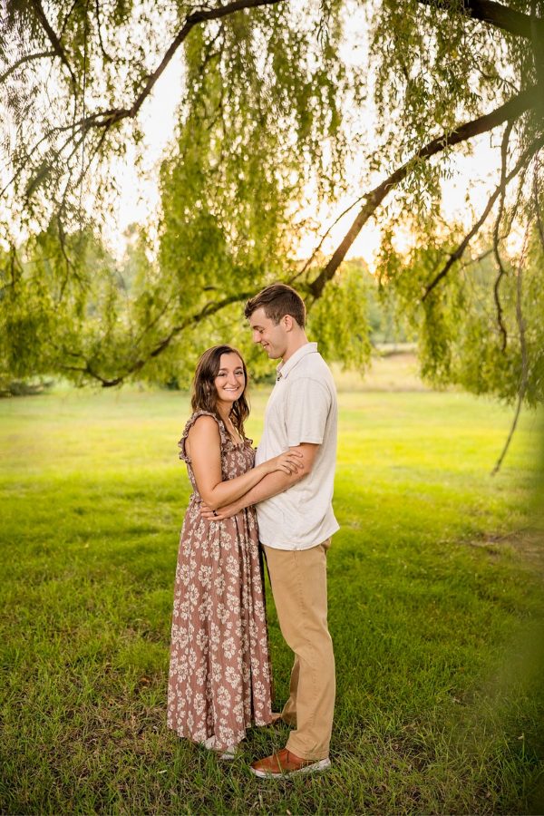 Add a bit of romanticism and whimsy to your engagement photoshoot with a stunning floral print maxi dress