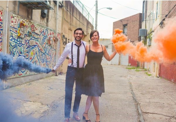 An engagement session with colored smoke bombs makes wonderfully lively images