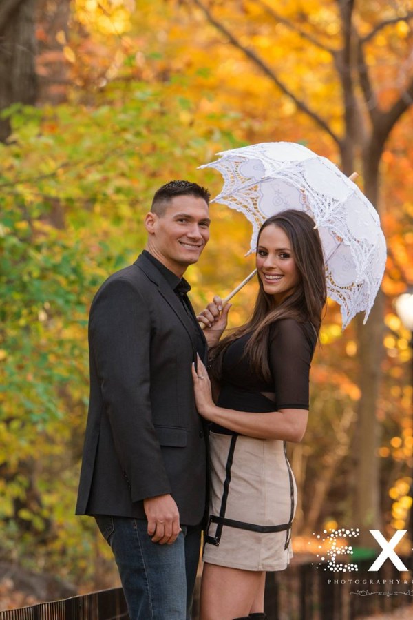 An umbrella served as a prop in their beautiful engagement photos