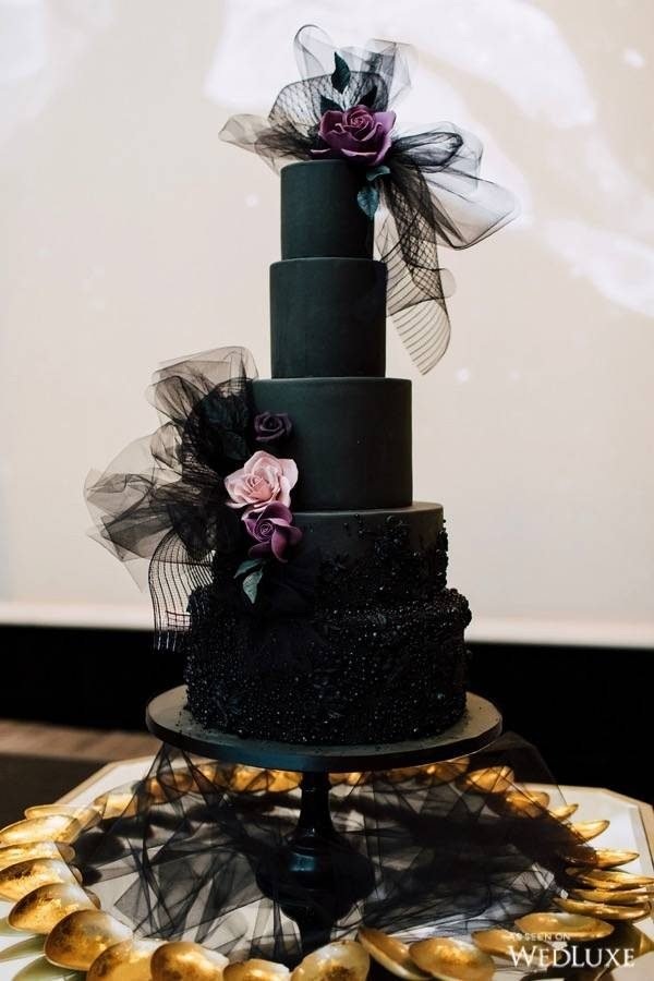 Dramatic black bow tulle wedding cake