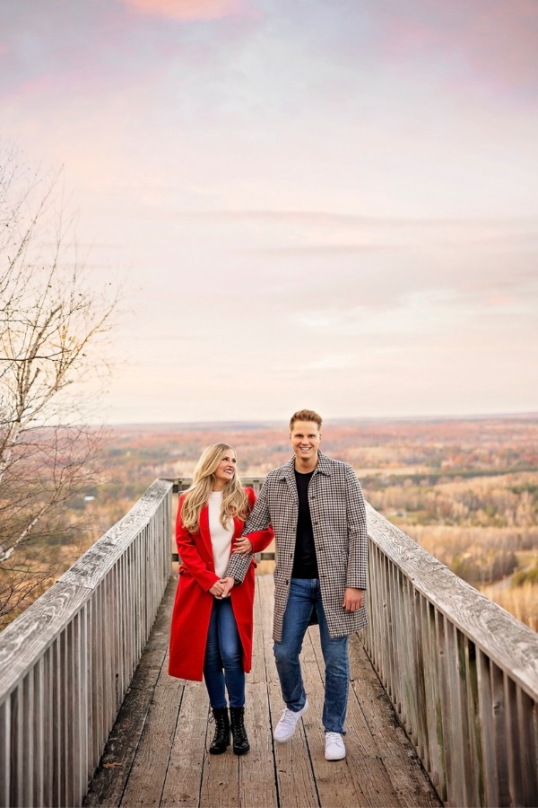 Dress warmly for your winter engagement photos by pairing a shirt and jacket with jeans and a beautiful pair of boots