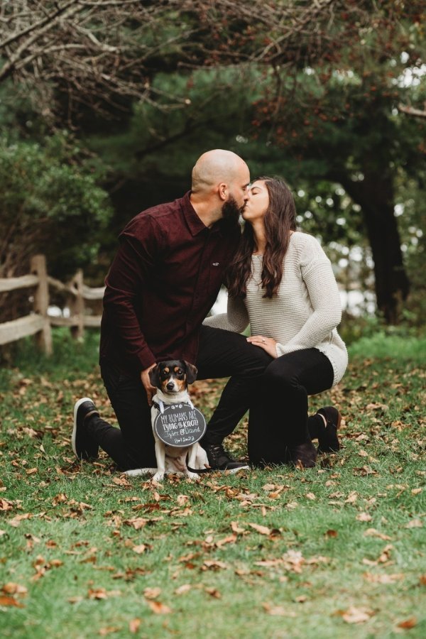 Having your dog in a fall engagement photo with the caption My humans are tying the knot