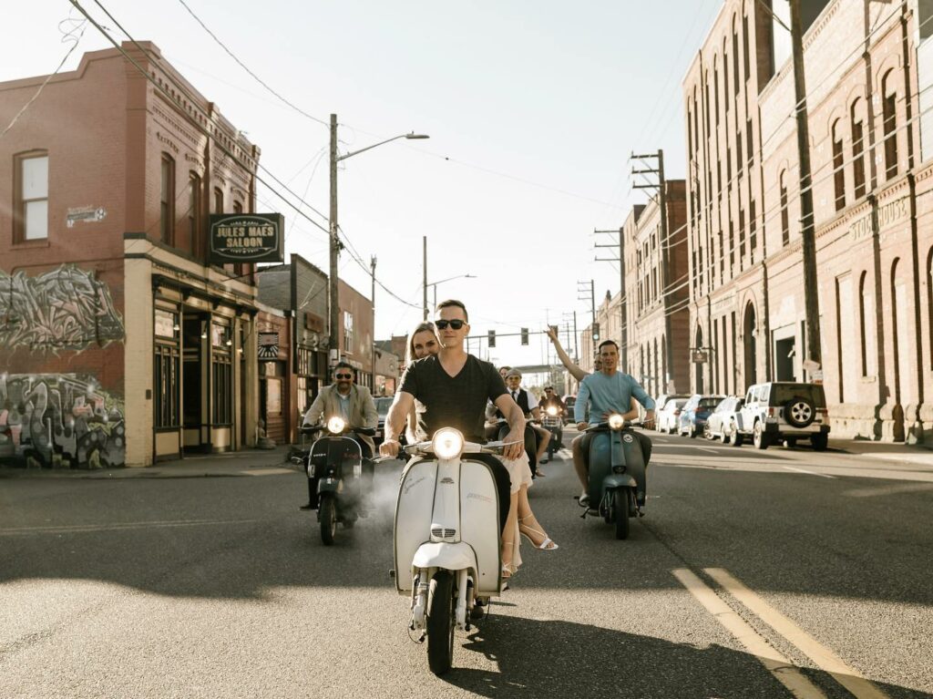 Photographic engagement session on a vintage scooter