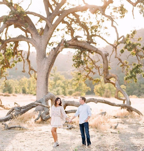 Picture perfect trees and sunlight set the scene for their engagement photo shoot
