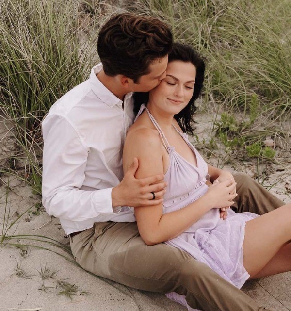 This beach engagement photo is a great way to keep your partner close while you take a few secret kisses