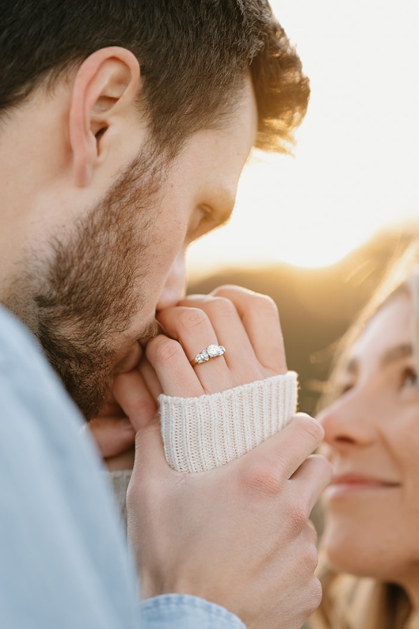 This engagement posture shows the rings splendor and the couples love story