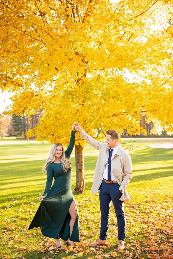This fall engagement photo show the couples love while the leaves are changing colors and they are dressed beautifully