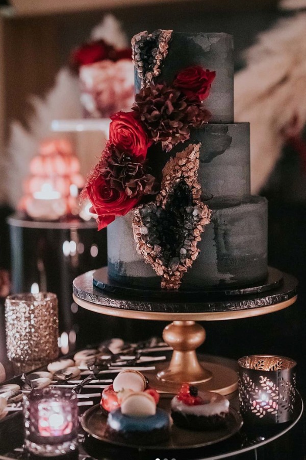 This red and black geode wedding cake is a stunning masterpiece capturing the wild unrefined beauty of nature in vivid dramatic tones