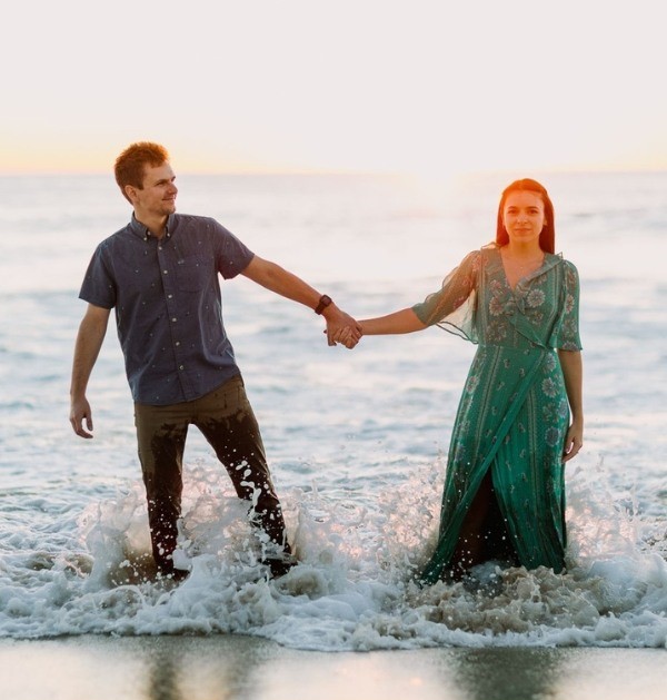 To add some excitement to your engagement session, try incorporating some action photographs. Pose them holding hands and beginning to walk along the shore; this is a tried-and-true classic.