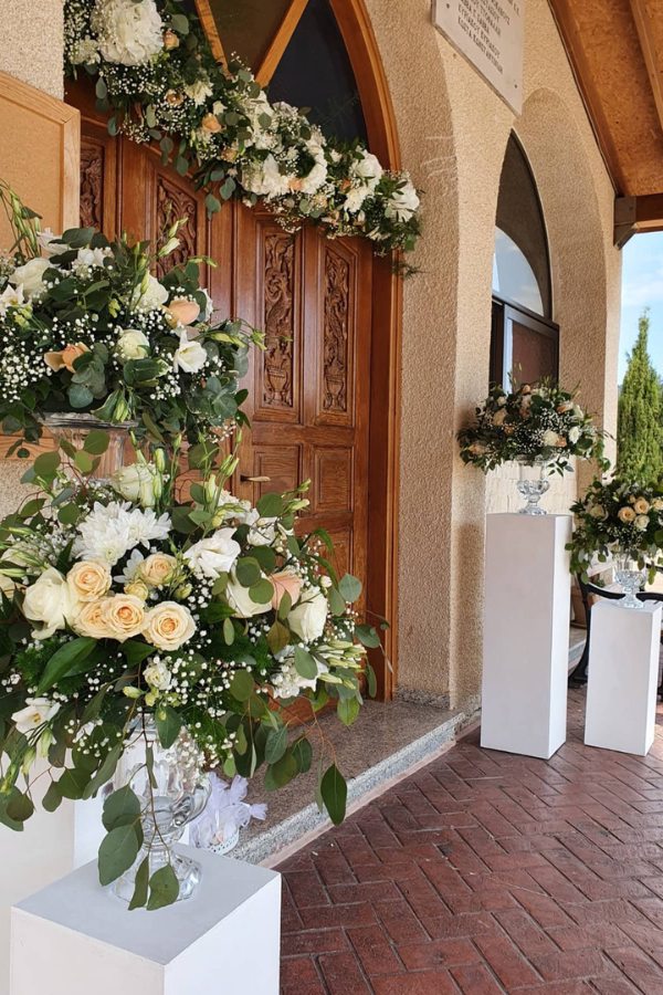 bold church doorway design with seasonal flowers