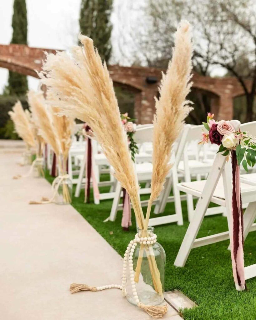 boho wedding aisle décor with pampas grass