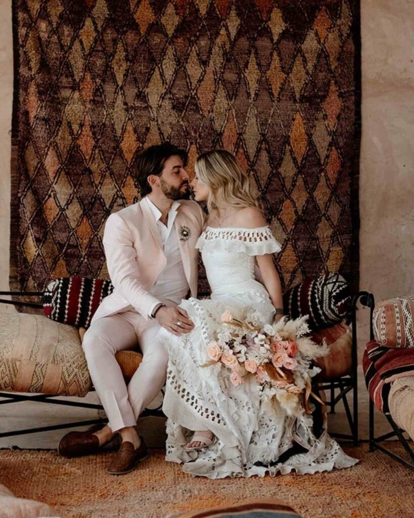lace bohemian wedding gown with dried flowers bouquet