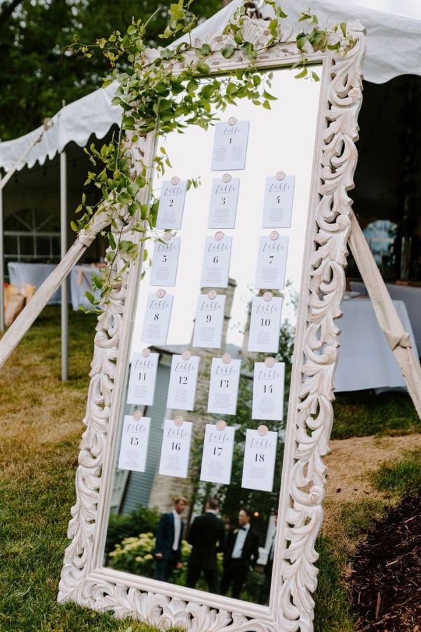 mirror seating chart ideas with greenery