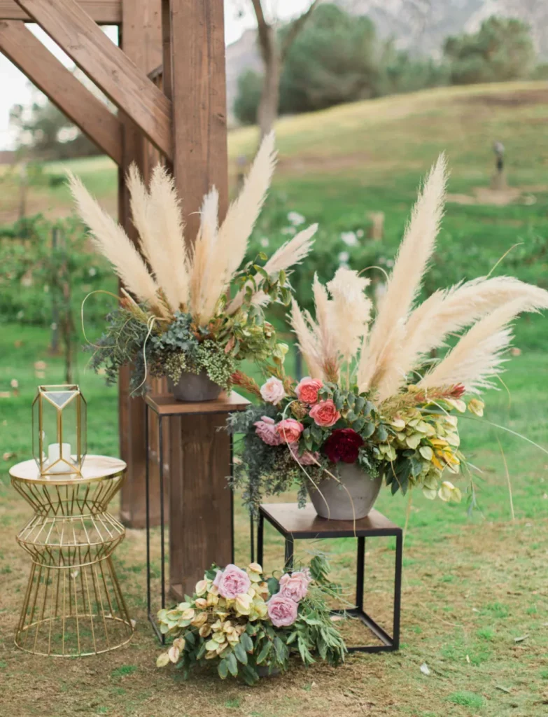 pampas grass boho wedding decorations with floral arrangements