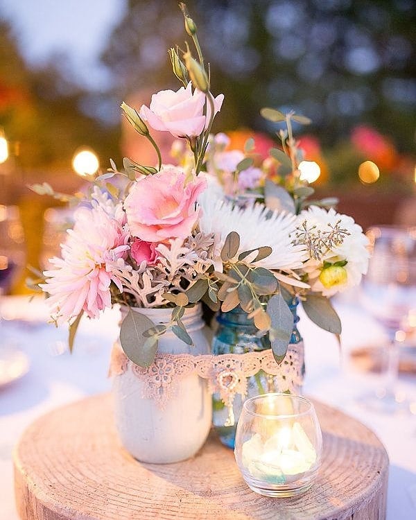 vintage boho wedding centerpiece with slice of woods and candles