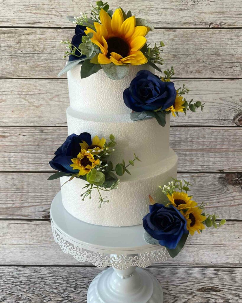 3-tiered sunflower and navy blue wedding cake