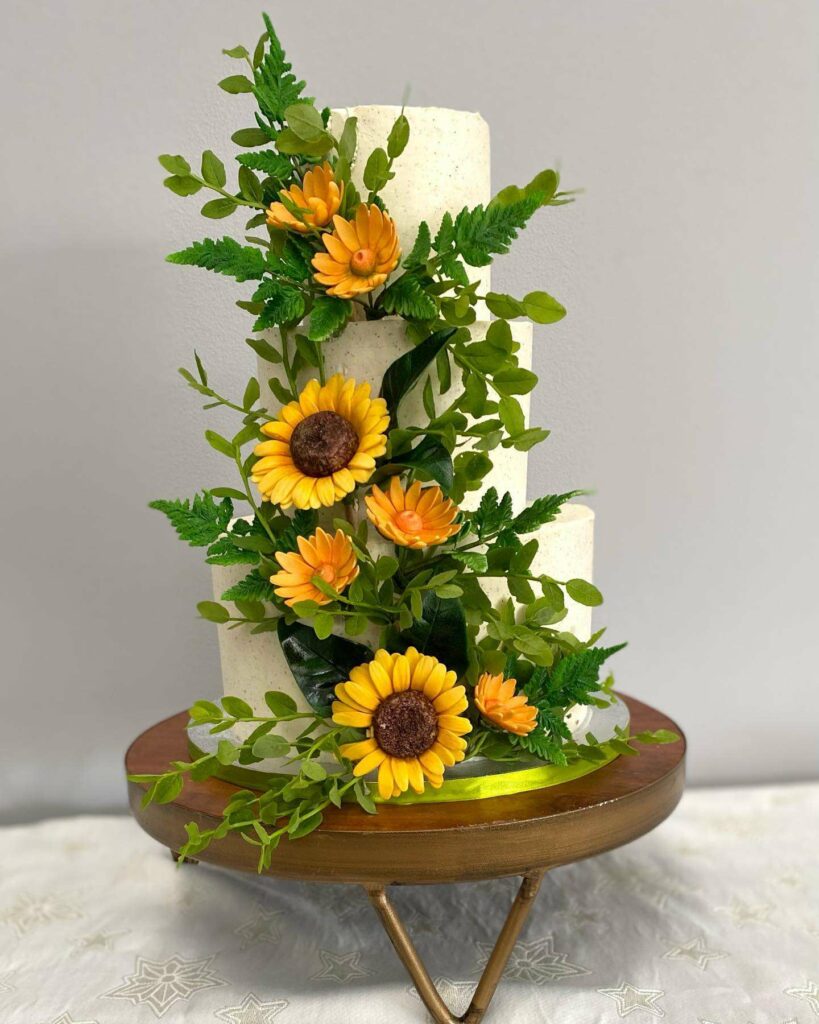 bright and greenery sunflower summer wedding cake