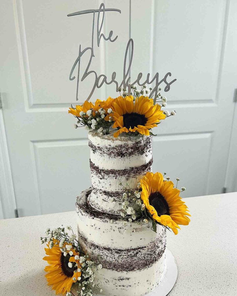 chocolate sunflower wedding cake with fresh florals