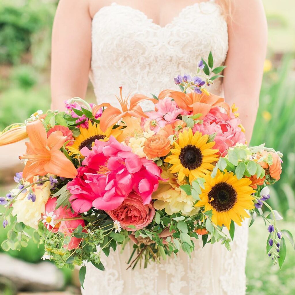 colorful bolod color sunflower theme wedding bouquet with peonies