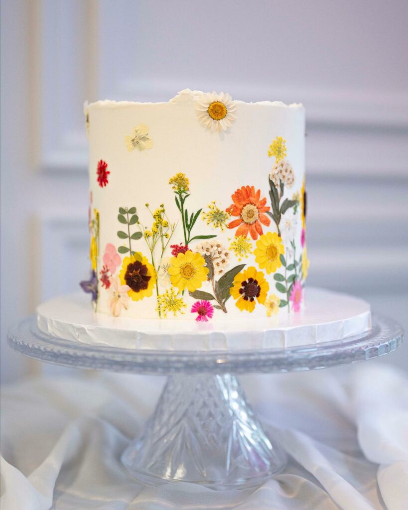 colorful sunflower painted wedding cake