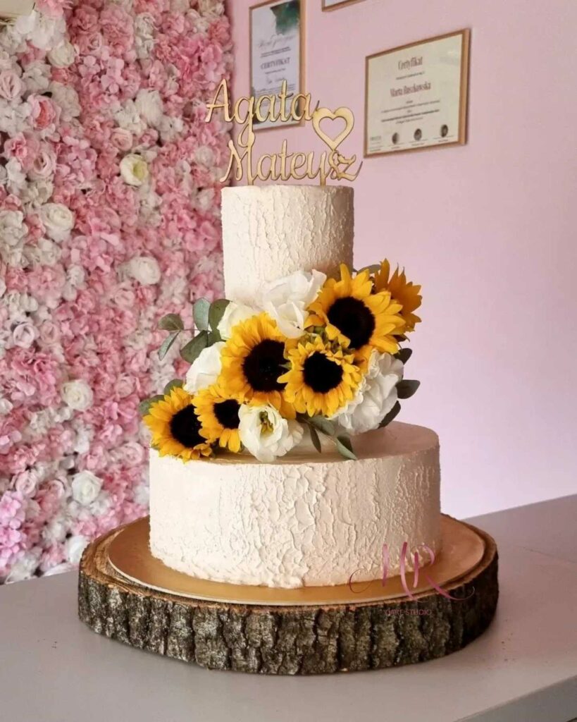 elegant rustic sunflower wedding cake with a touch of white and green