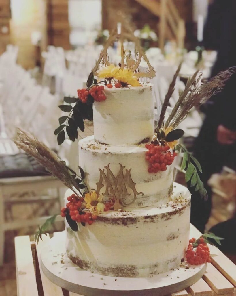 rustic boho sunflower wedding cake with chocolate cream and cherries