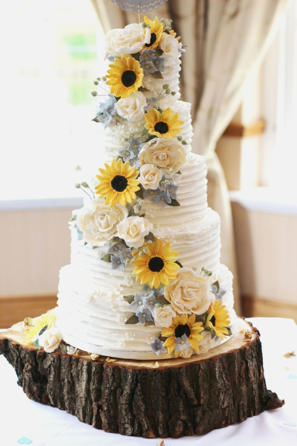 sunflower tier buttercream wedding cake on tree stump