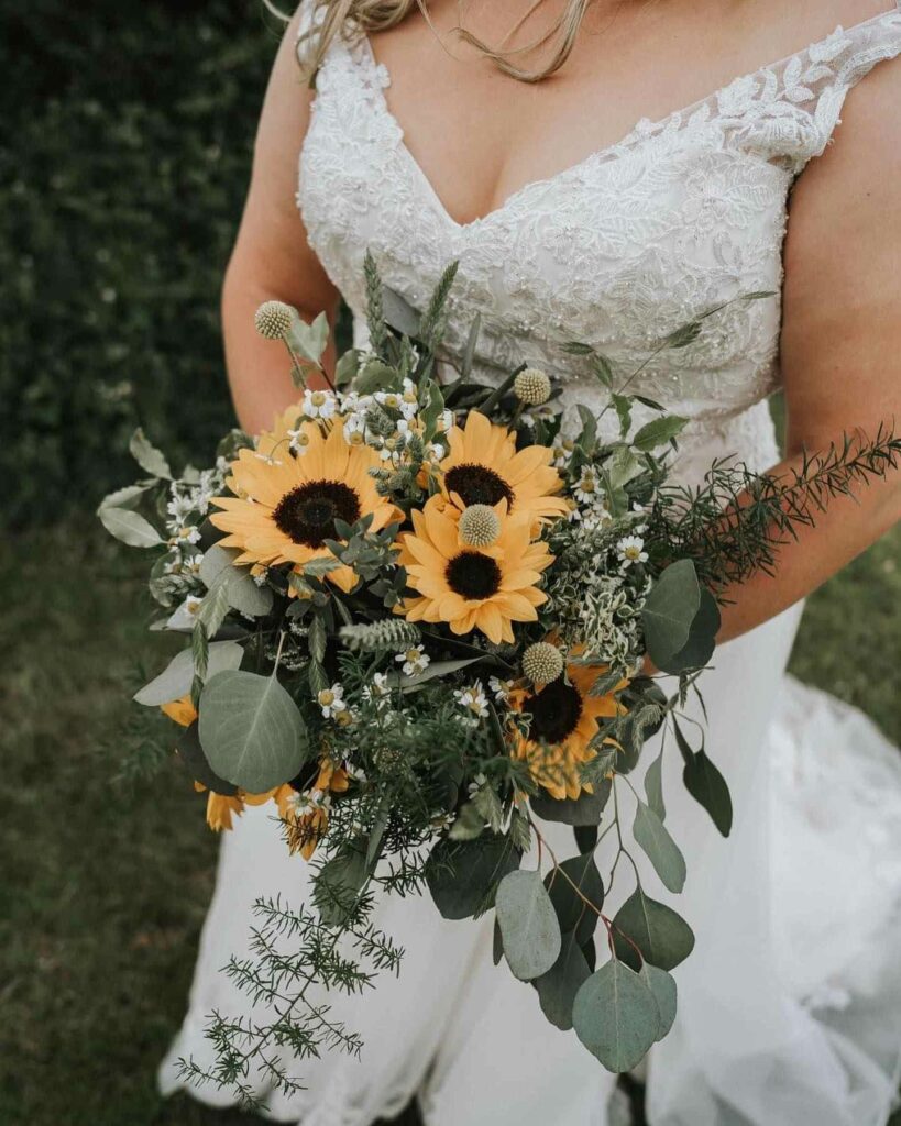 sunflower barn wedding rustic theme bouquet with greenery