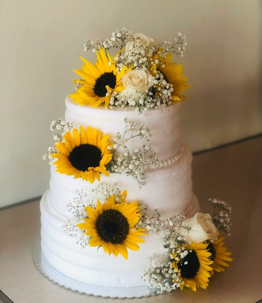 sunflower simple roses wedding cake with baby's breath