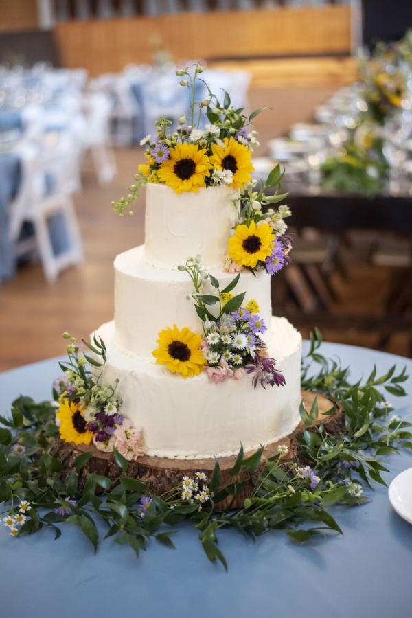 sunflower three tier summer wedding cake with wildflowers