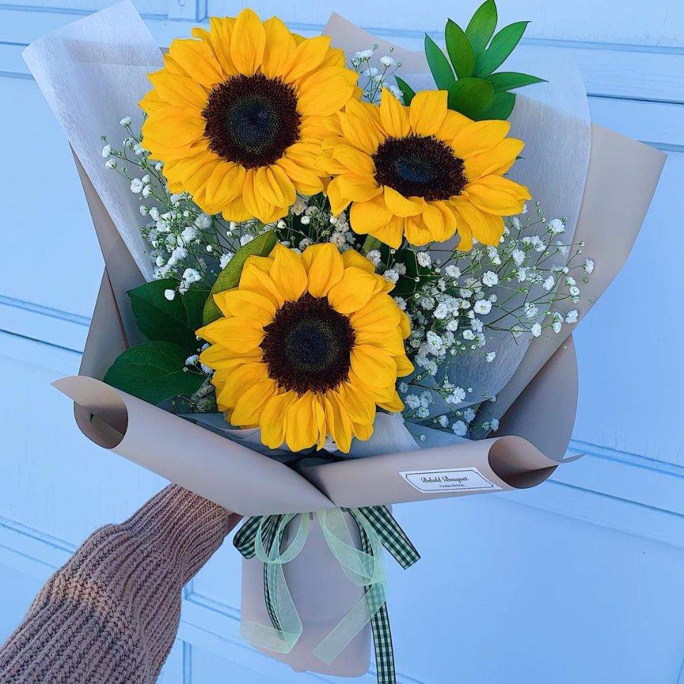 sunflower with baby breath wrapped wedding bouquet