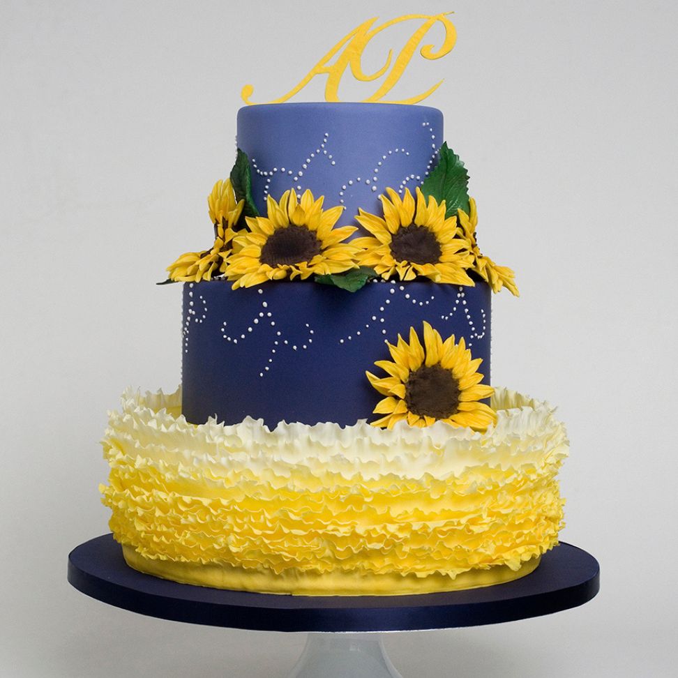 sunflower yellow and navy blue themed wedding cake