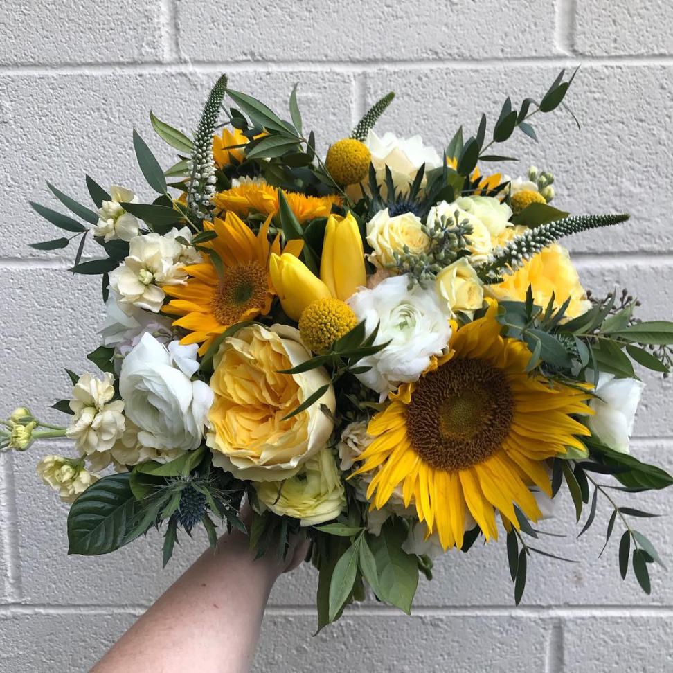 sunflower yellow and white wedding bouquet with greenery