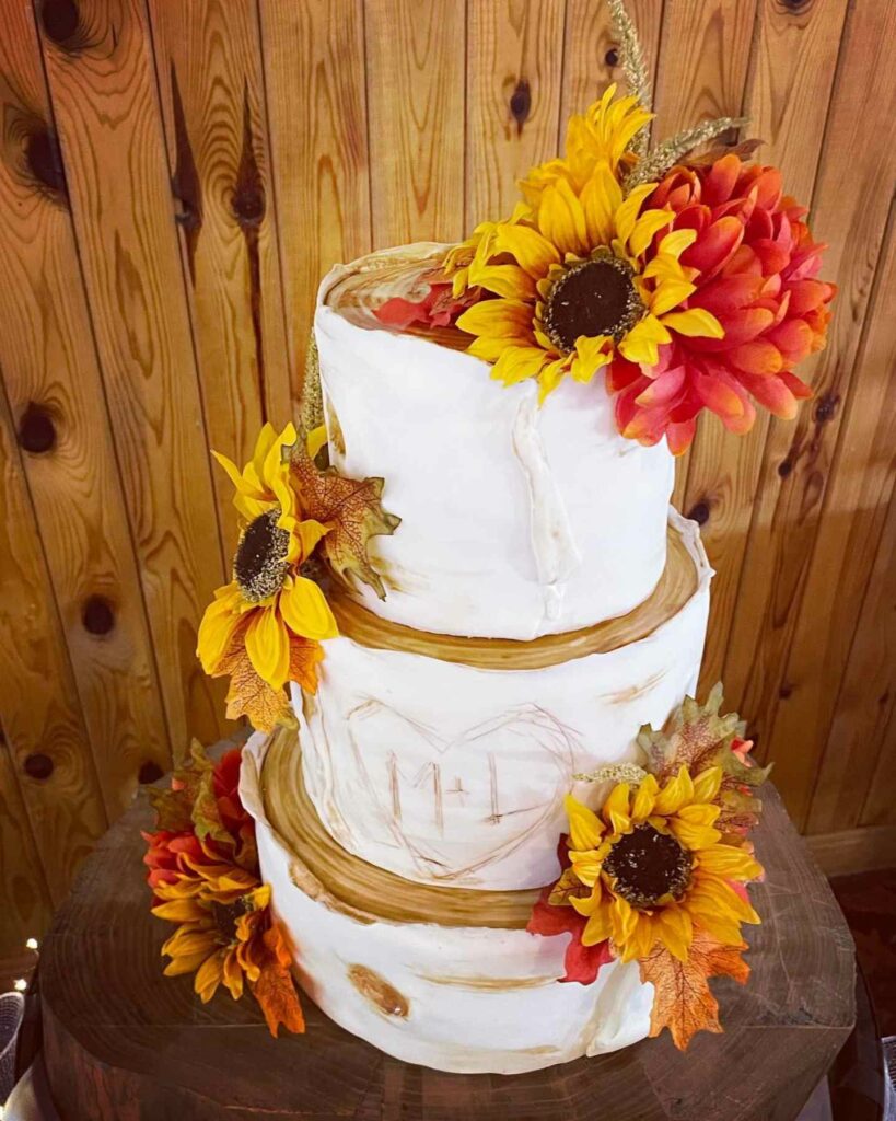 sunflowers and fall foliage autumn wedding cake