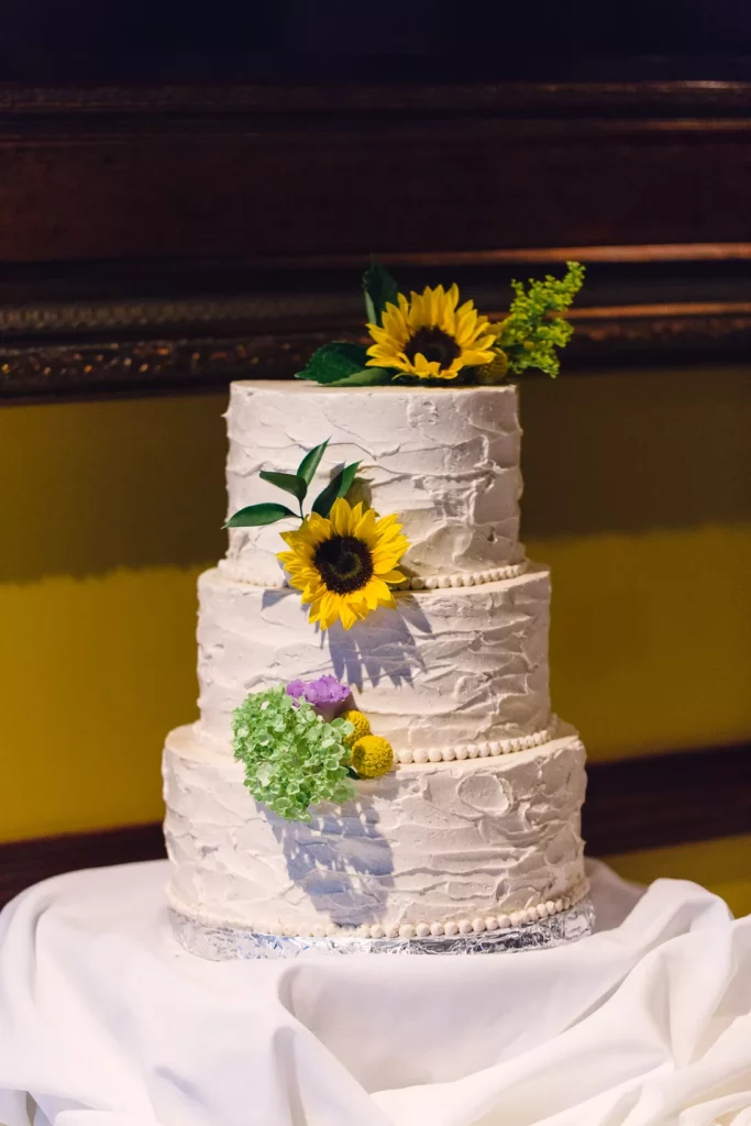 textured buttercream sunflower topped wedding cake
