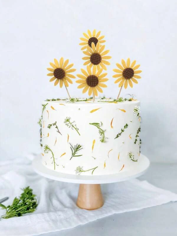 white and green decor sunflower topper wedding cake