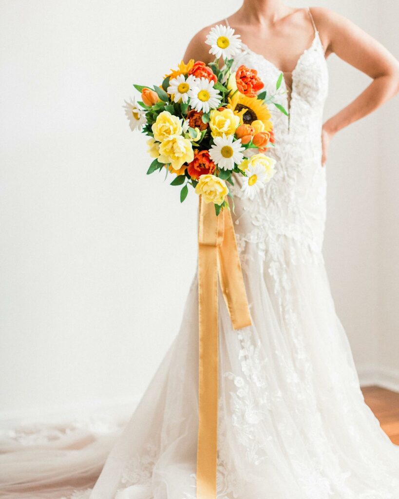 yellow and orange sunflower summer wedding bouquet with ribbon
