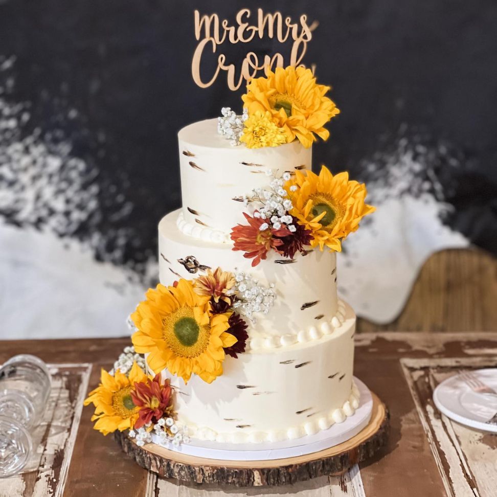 yellow and red velvet three tiered fall themed sunflower wedding cake