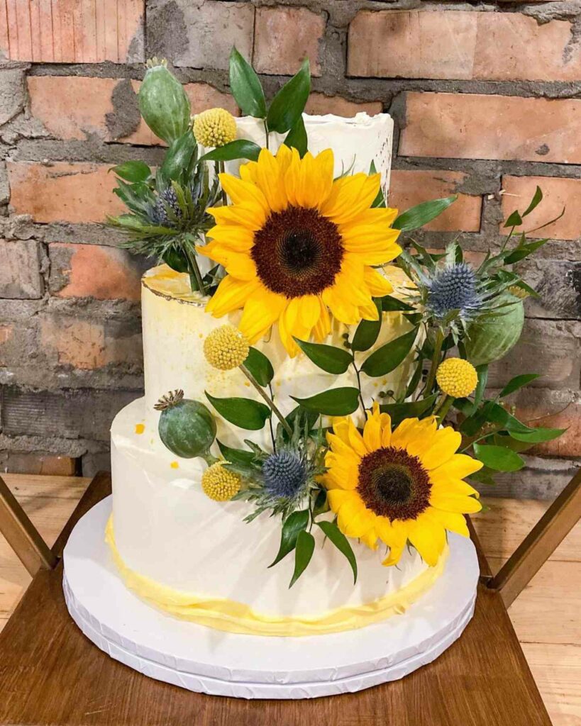 yellow and white sunflower adorn summer wedding cake