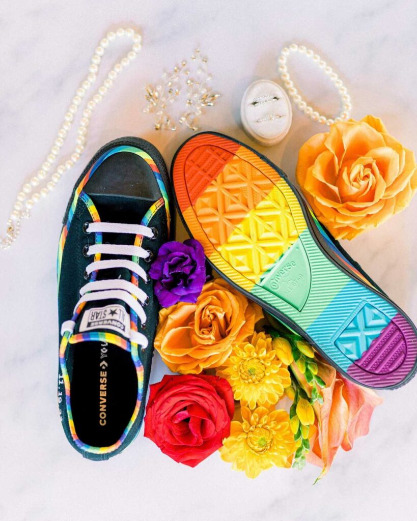 black colorful LGBT wedding sneakers and fresh blooms