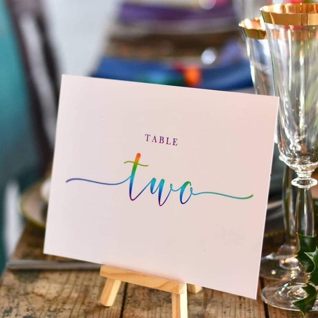 colorful table number for lesbian barn wedding in winter